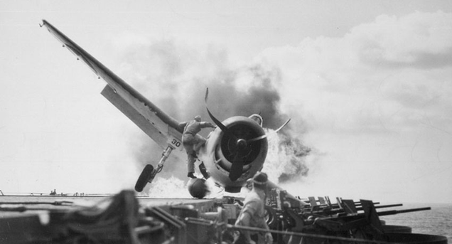 The Iron Works saves another pilot: a Hellcat piloted by Ens. Byron Johnson crash lands on USS Enterprise, while catapult officer Lieutenant Walter Chewing steps on the plane’s belly tank to rescue the pilot.